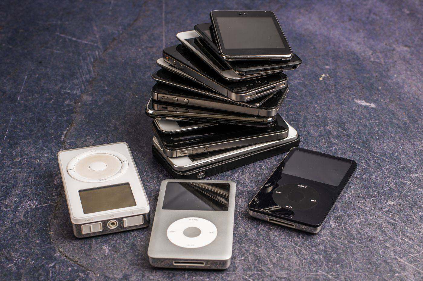 A pile of retired phones and music players