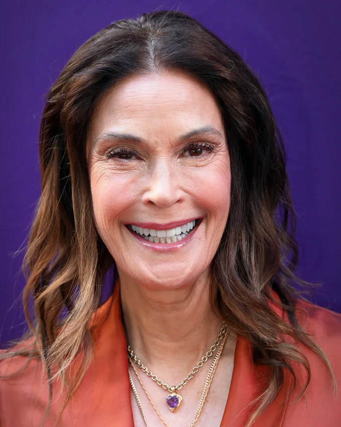 Teri Hatcher smiling on a red carpet in 2026
